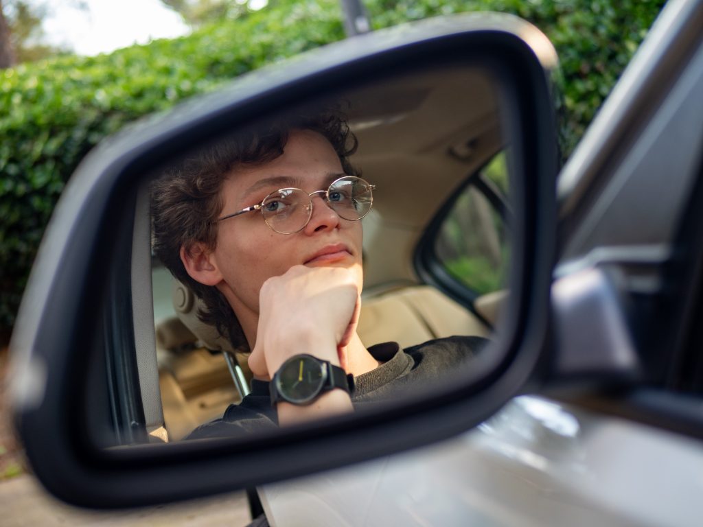 Portrait in Car Mirror